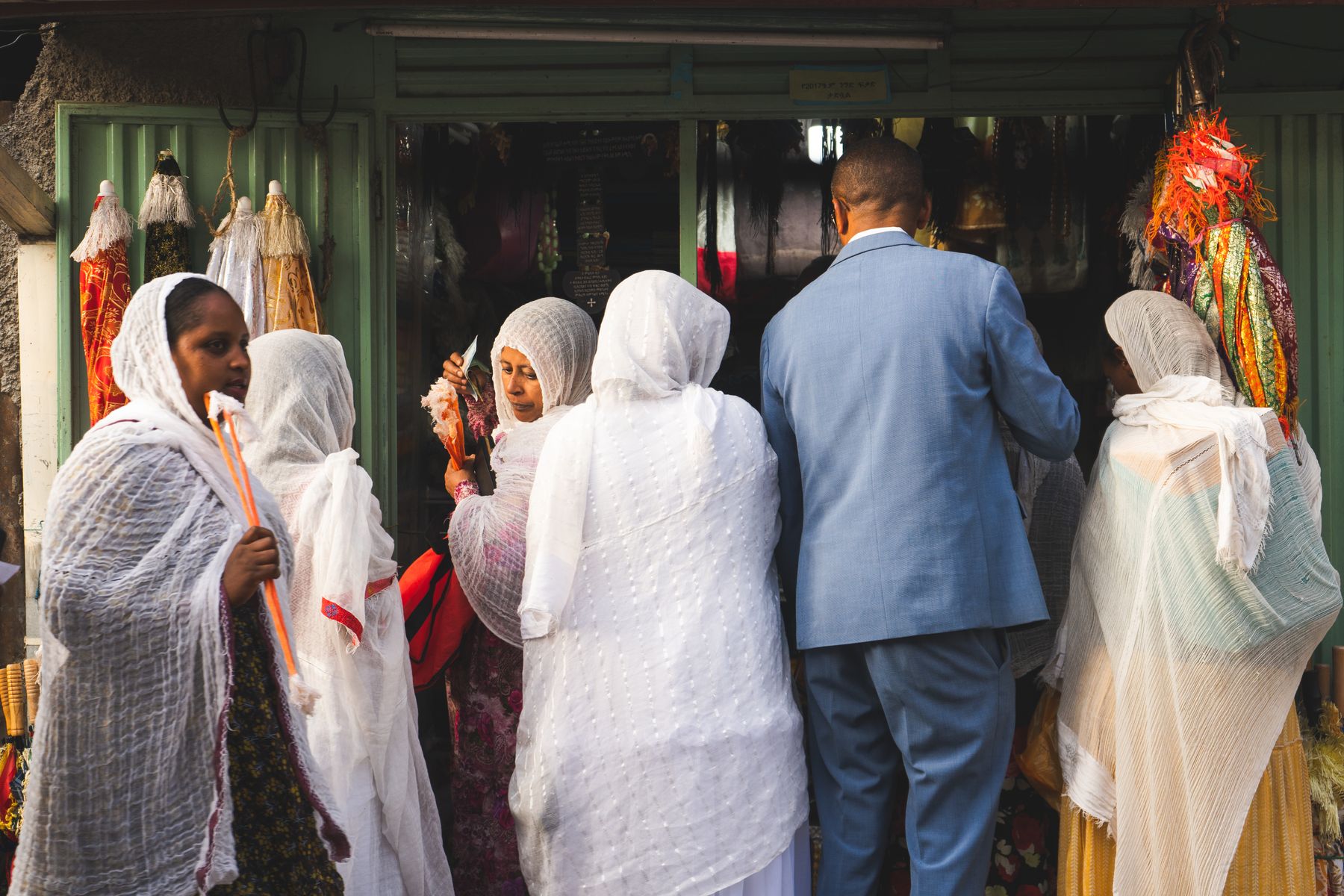 People in traditional Ethiopian clothing gathering at a neighbourhood market in Addis Ababa