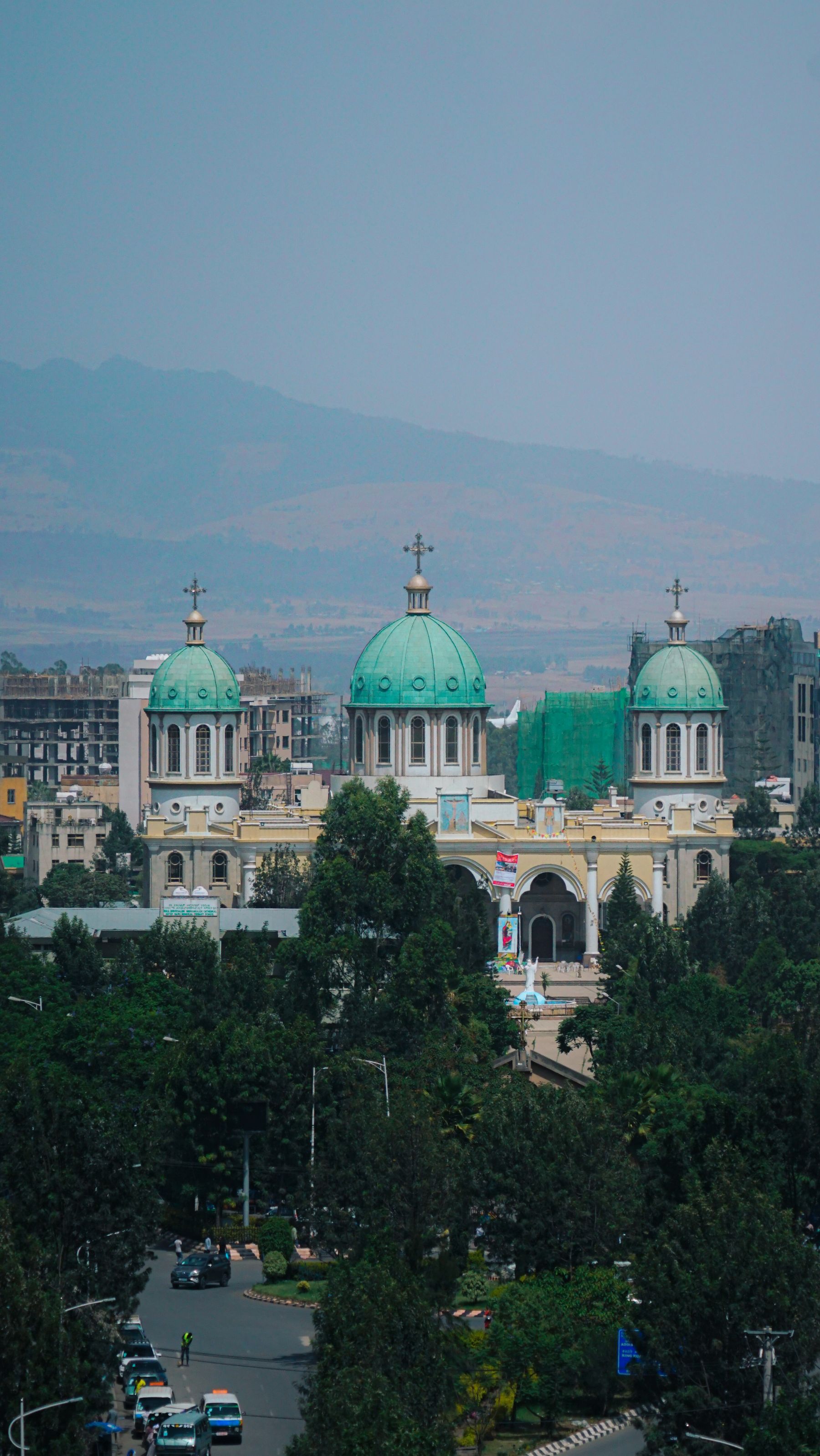 Medhane Alem Cathedral rising above trees and buildings in Addis Ababa
