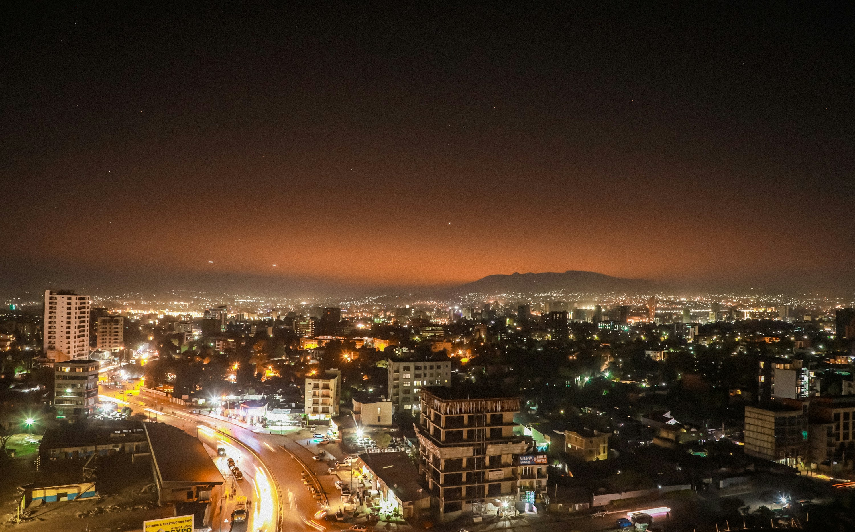 Addis Ababa illuminated at night beneath the Entoto hills