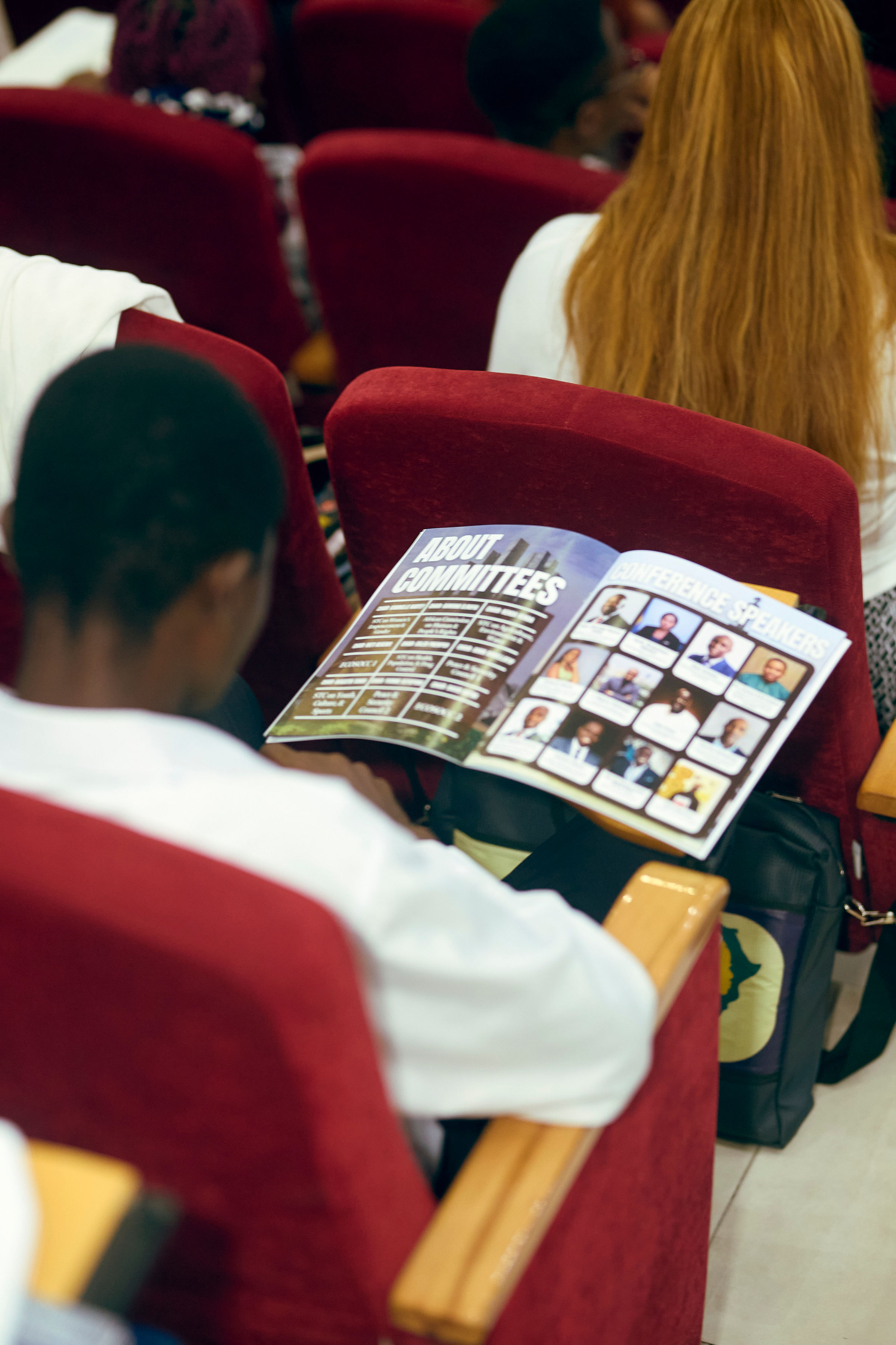 A YMAU V delegate reviewing the printed conference and committee information pack