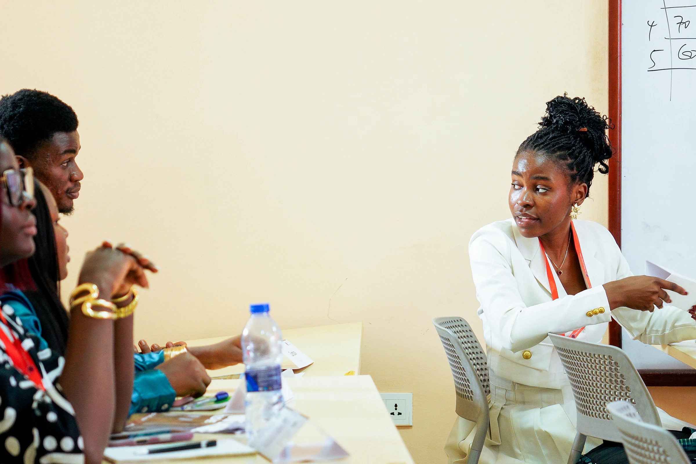 Delegates in a focused discussion during YMAU V