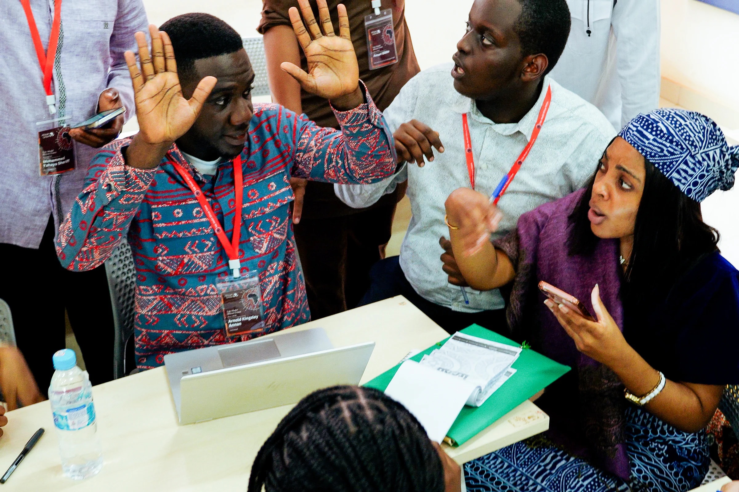 Delegates in an animated committee discussion during YMAU V