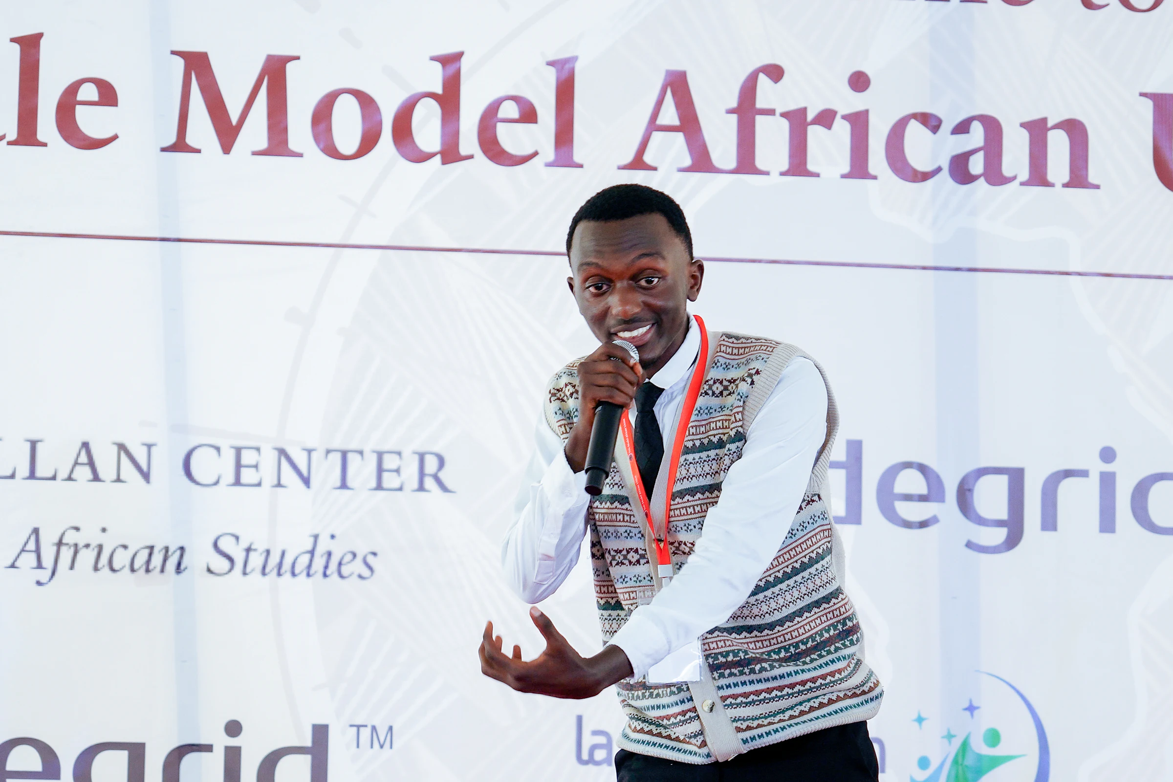 A participant pitching an idea on the YMAU V stage