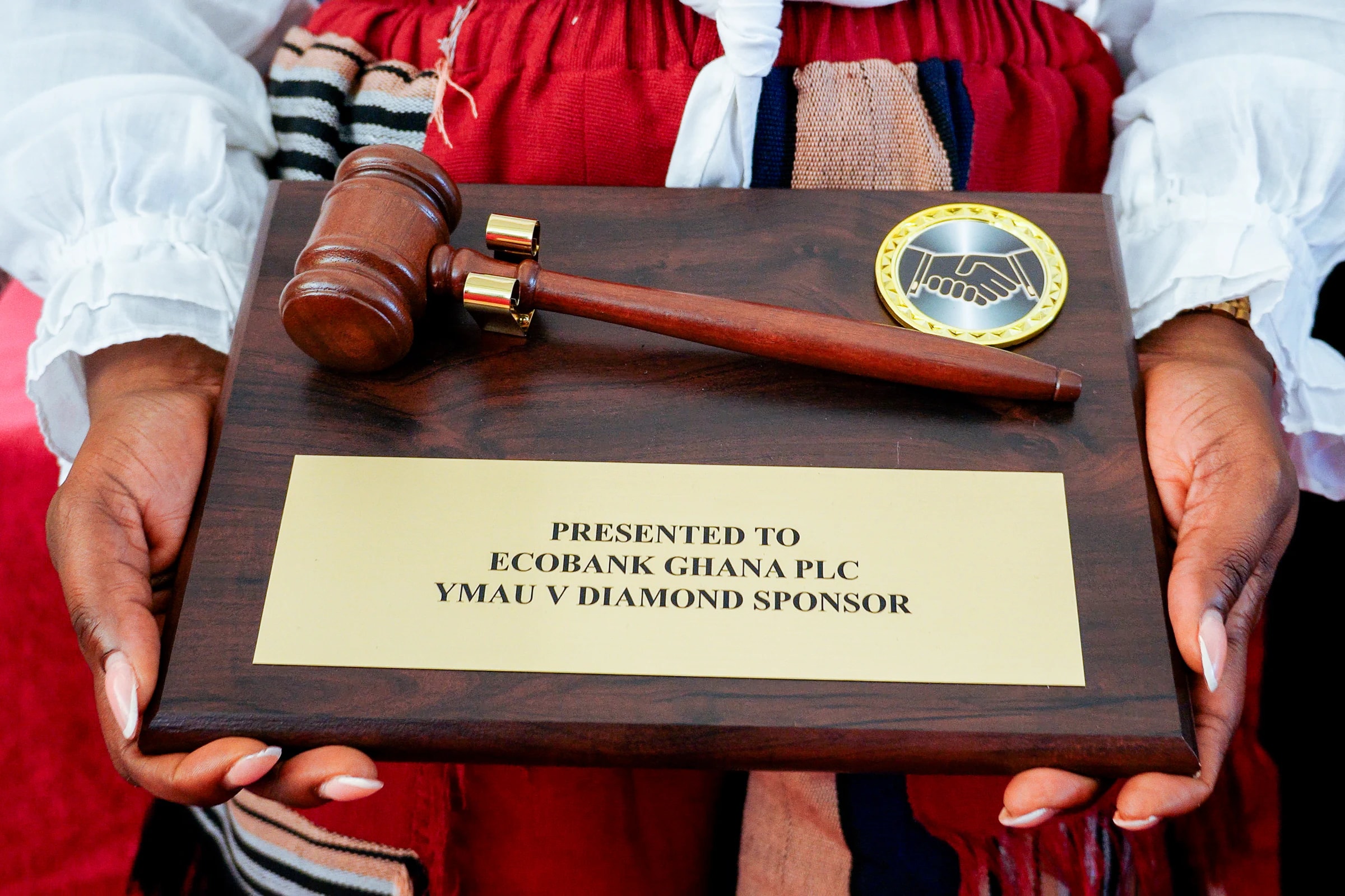 A partner recognition plaque presented at YMAU V